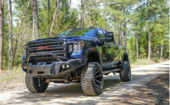 A manager reviewing real-time data on a digital dashboard to improve fleet safety and efficiency for a logistics company.