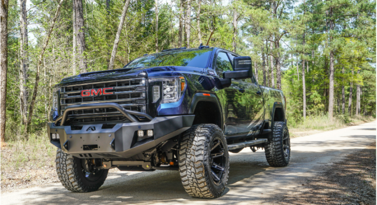 A manager reviewing real-time data on a digital dashboard to improve fleet safety and efficiency for a logistics company.